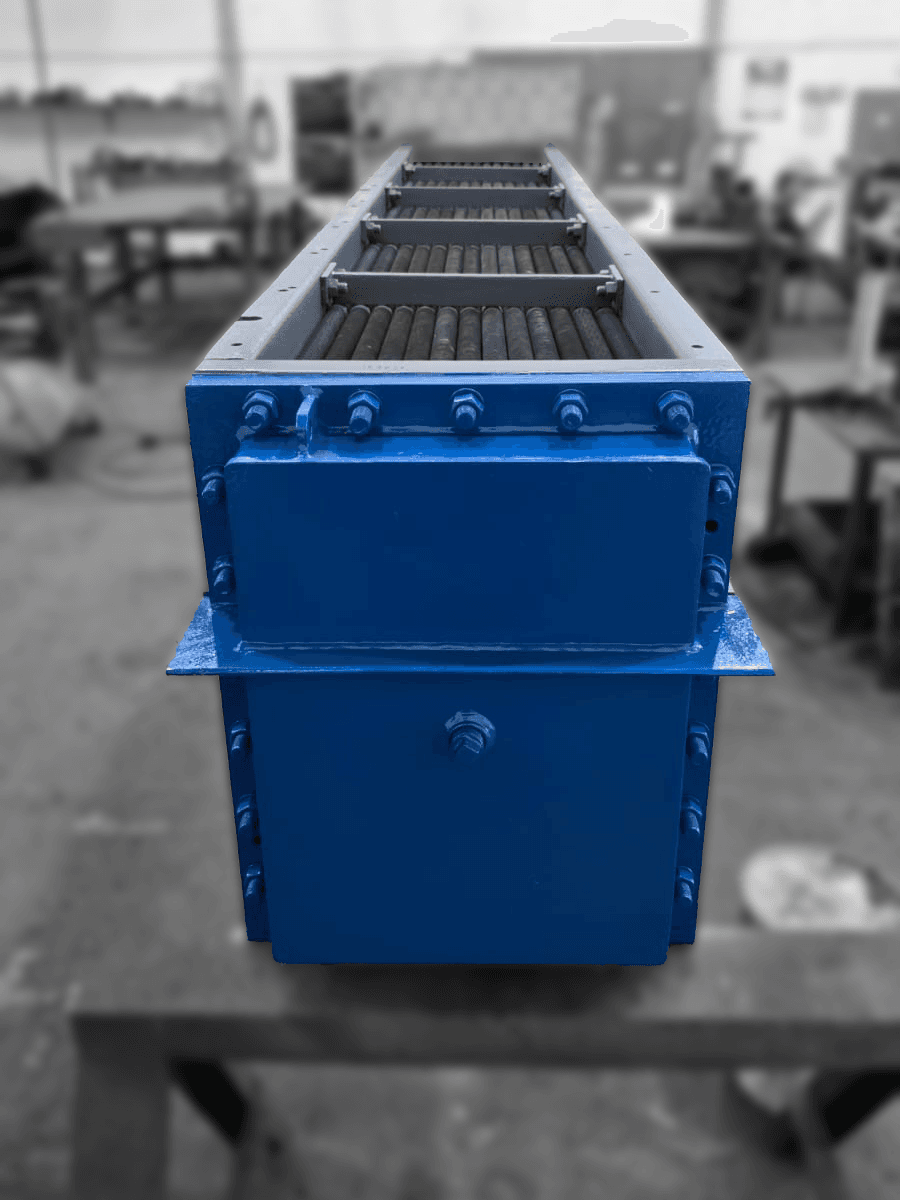 A blue industrial heat exchanger is prominently displayed in a workshop. Background tools and equipment are blurred.